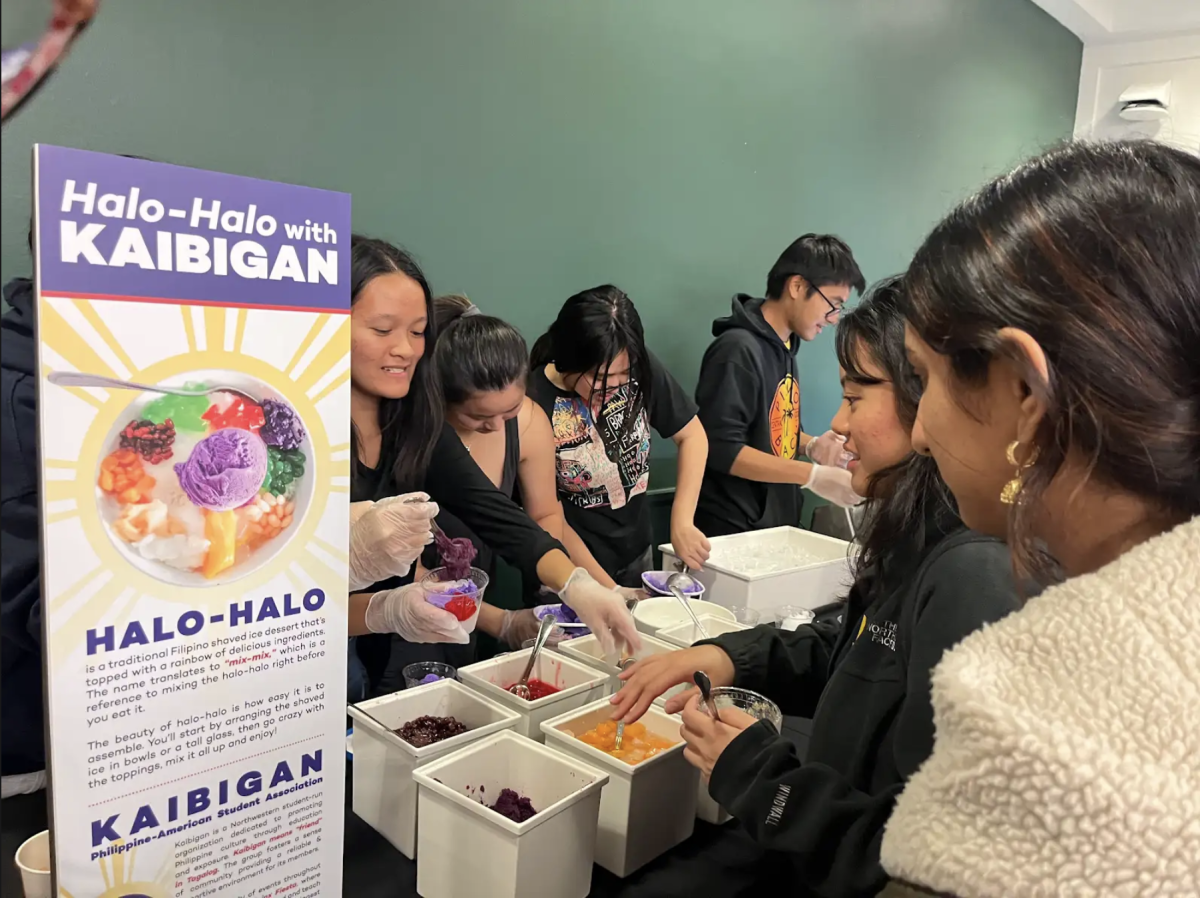 Kaibigan club members serve halo halo at Sargent dining hall. The dessert consists of ube ice cream, shaved ice, and jelly toppings.